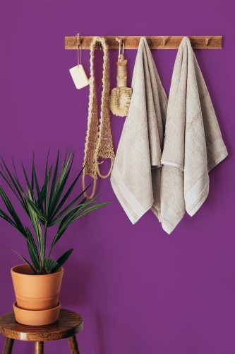 Boho style bathroom decorated with Solid purple peel and stick wallpaper