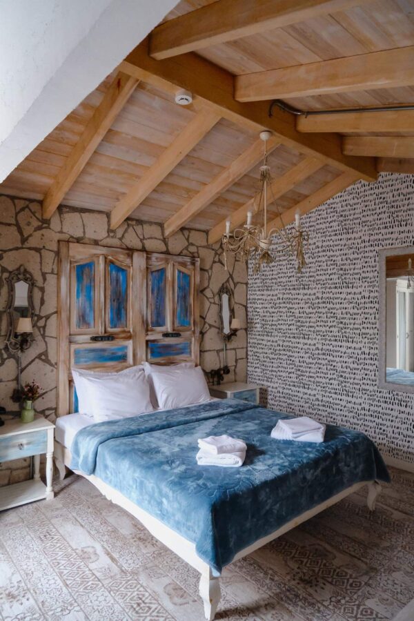 Farmhouse style bedroom decorated with Splashed peel and stick wallpaper