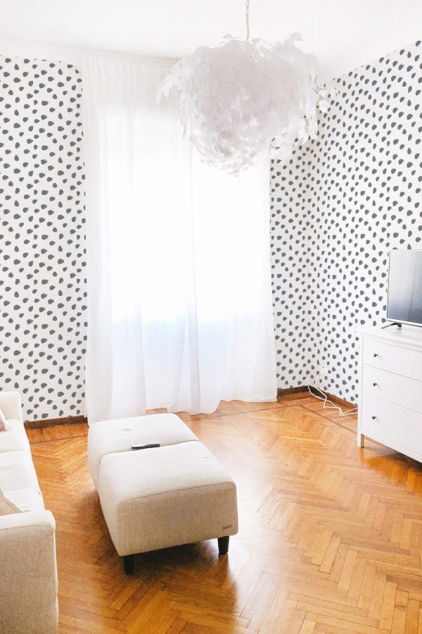 Modern boho style living room decorated with Spotted peel and stick wallpaper