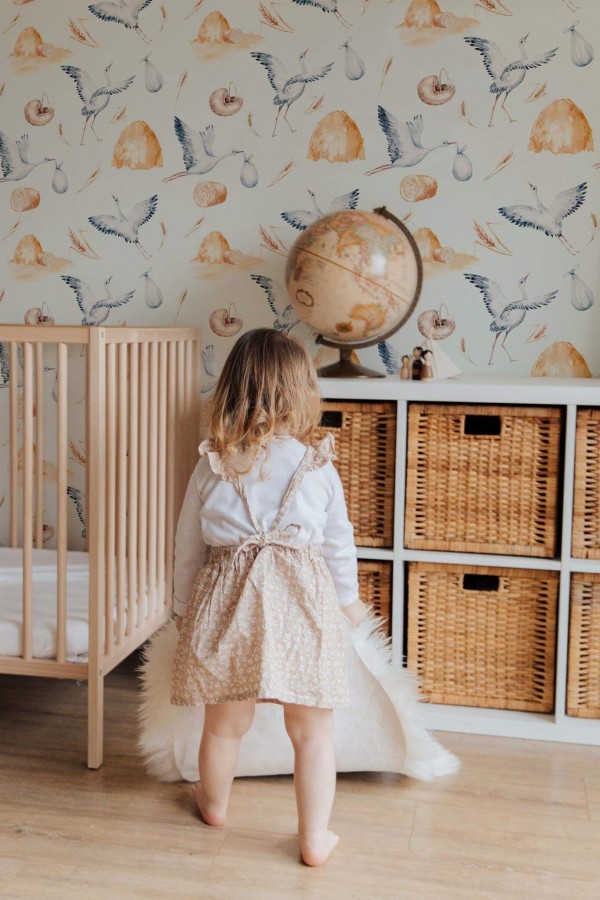 Gender neutral style kids room decorated with Stork nursery peel and stick wallpaper