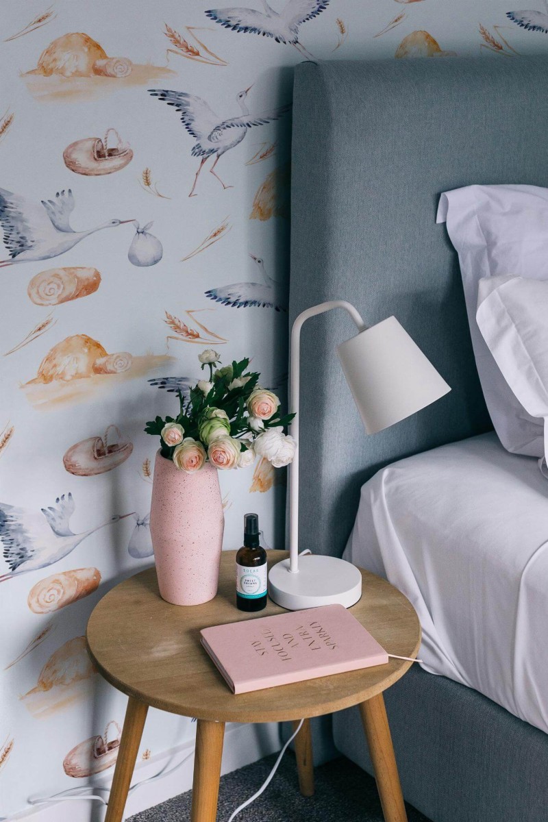 Rustic style bedroom decorated with Stork nursery peel and stick wallpaper
