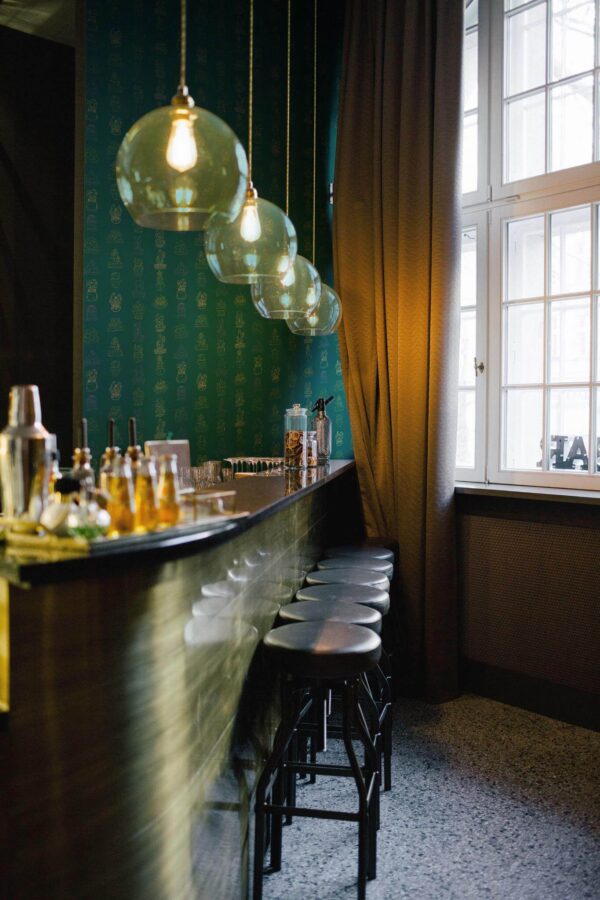Scandinavian style living room decorated with Teal cactus peel and stick wallpaper