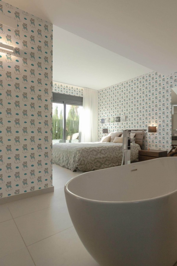 Modern style bedroom with open bathroom decorated with Teddy peel and stick wallpaper