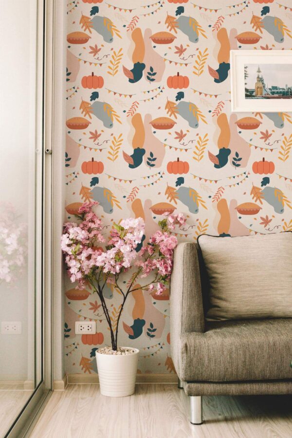 Fun Thanksgiving peel and stick wallpaper with abstract turkeys, pumpkins, and fall leaves in a cozy modern living room with soft décor