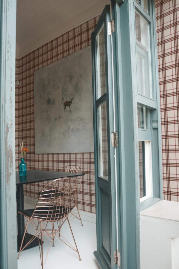Minimal coastal style cafe decorated with Thanksgiving plaid peel and stick wallpaper