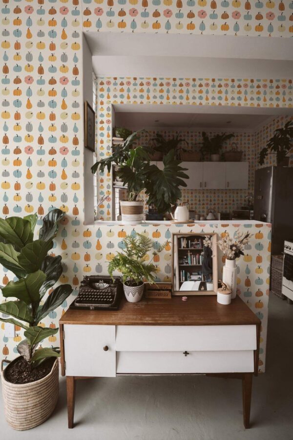 Boho style living room and kitchen decorated with Tiny pumpkins peel and stick wallpaper and green plants