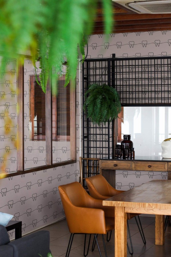Mid-century modern style dining room decorated with Tooth dentist peel and stick wallpaper and black industrial accents