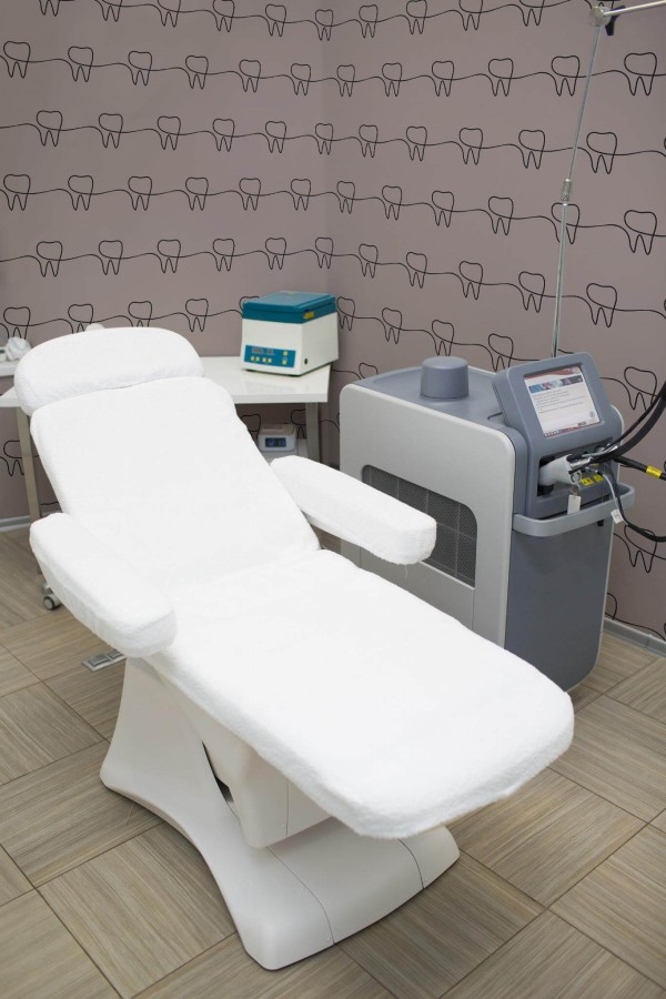 Minimal style dentist office decorated with Tooth dentist peel and stick wallpaper