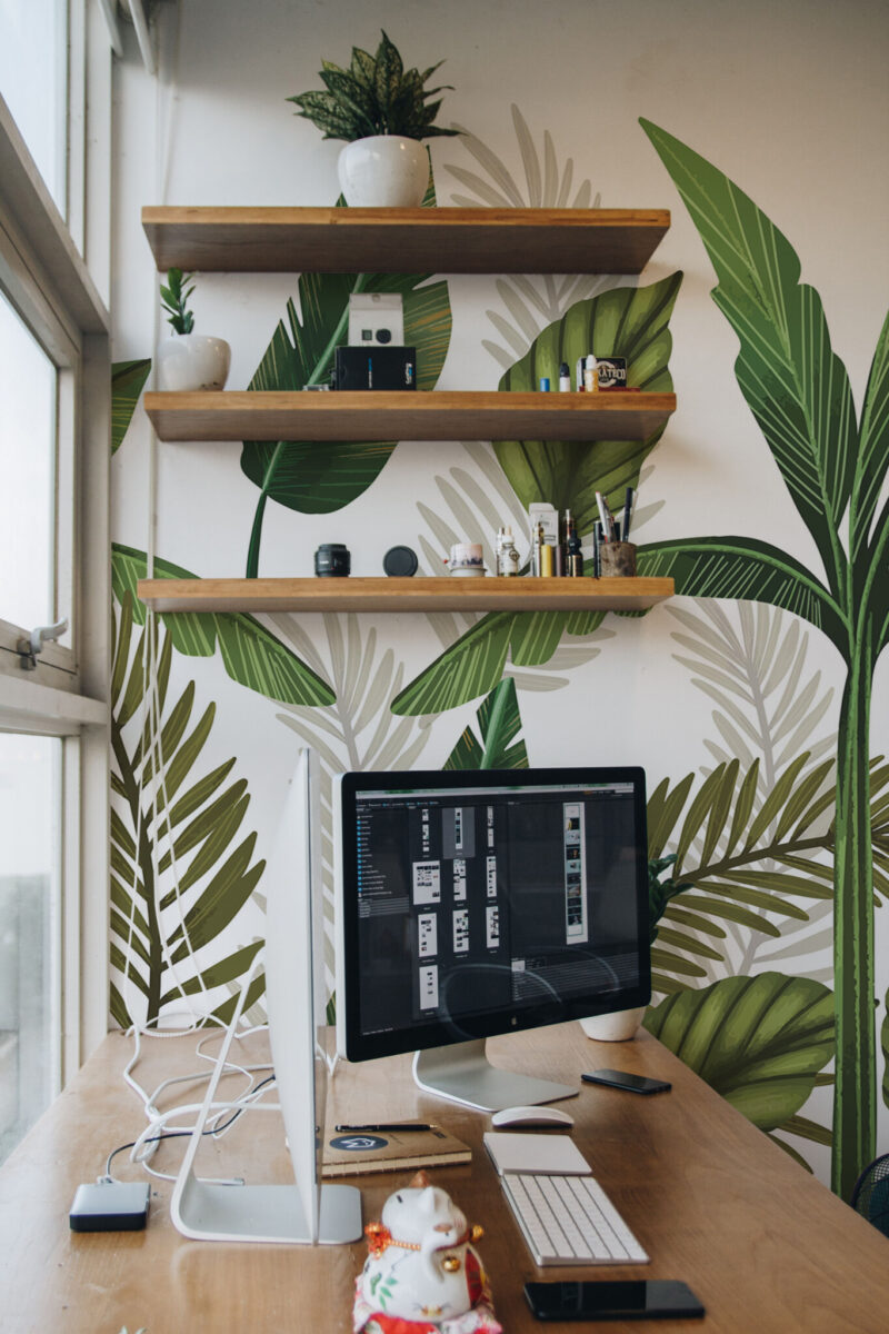 Leaf Bliss Wall Mural with classic green tropical leaves on a light beige background, perfect for offices, workspaces, or elegant botanical accent walls.