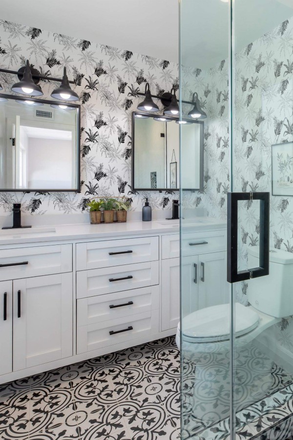 Rustic farmhouse style bathroom decorated with Tropical palm peel and stick wallpaper