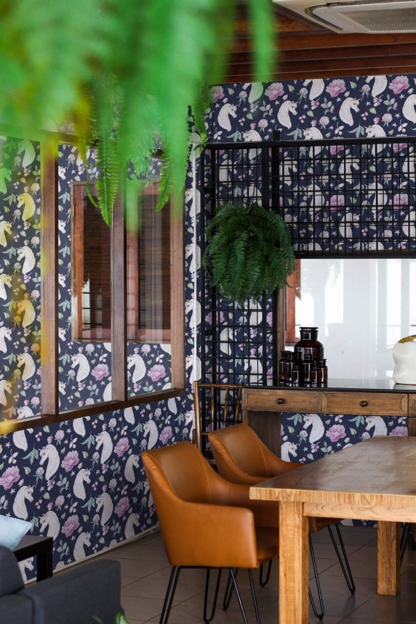 Mid-century modern style dining room decorated with Unicorn nursery peel and stick wallpaper and black industrial accents