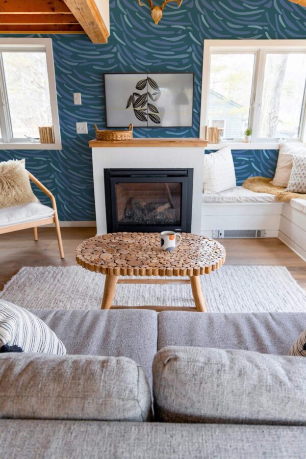Farmhouse boho style living room decorated with Van Gogh inspired peel and stick wallpaper