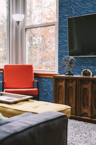 Rustic style living room decorated with Van Gogh inspired peel and stick wallpaper
