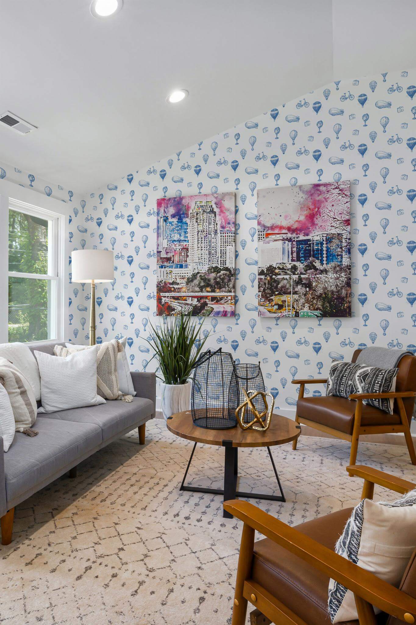 Mid-century modern style living room decorated with Vintage air balloon peel and stick wallpaper and colorful funky artwork