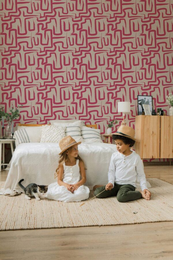 Scandinavian style bedroom decorated with Viva magenta brush stroke peel and stick wallpaper