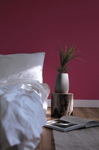 Minimal scandinavian style bedroom decorated with Viva Magenta peel and stick wallpaper