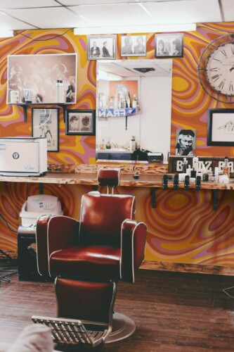 Vibrant Bright Groove wall mural with orange and pink funky abstract pattern, perfect for barber shops, creative studios, or bold accent walls.