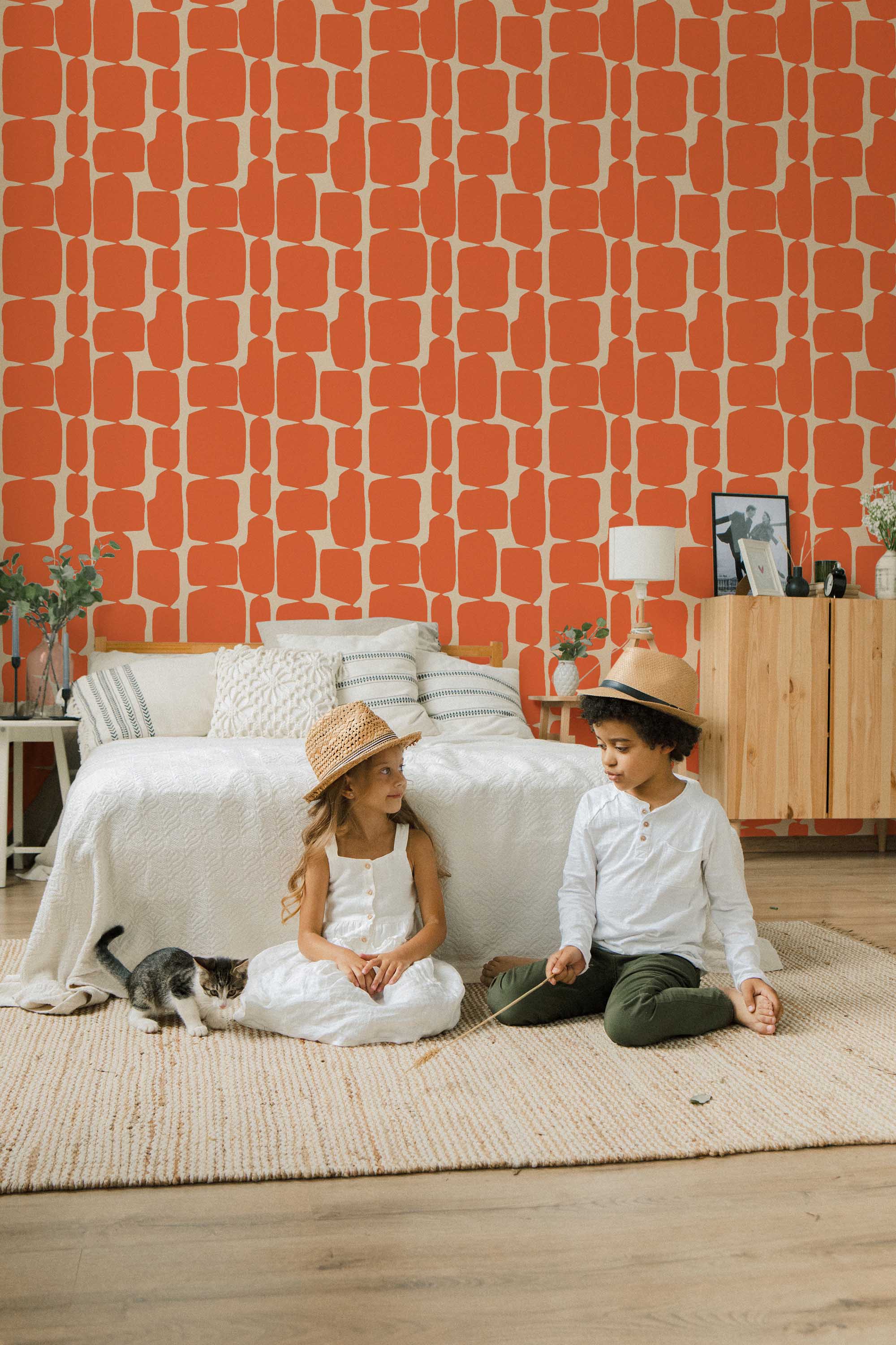 Fancy Walls peel and stick wallpaper with bold orange retro geometric shapes for a vibrant mid-century inspired interior.