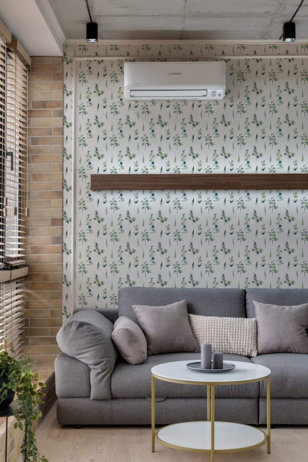 Scandinavian style living room decorated with Watercolor green leaf peel and stick wallpaper