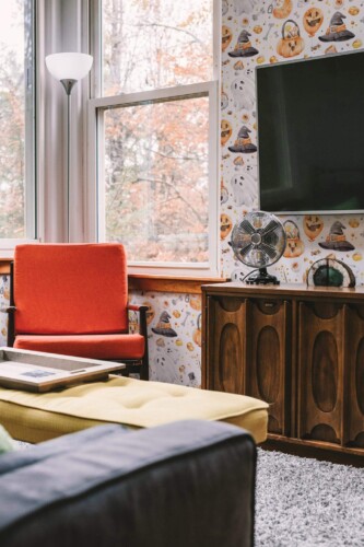 Rustic style living room decorated with Watercolor halloween peel and stick wallpaper