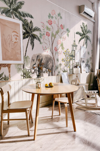 Tropical Landscape Bliss Wall Mural with green palms, plants, and jungle animals in a lush landscape, ideal for living rooms and nature-inspired homes.