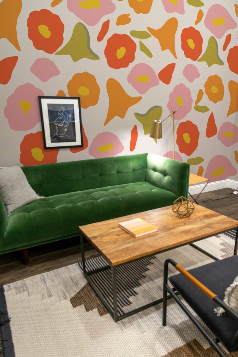 Delightful Pink Floral wall mural with orange and pink retro floral design, perfect for living rooms, bedrooms, or playful accent walls.