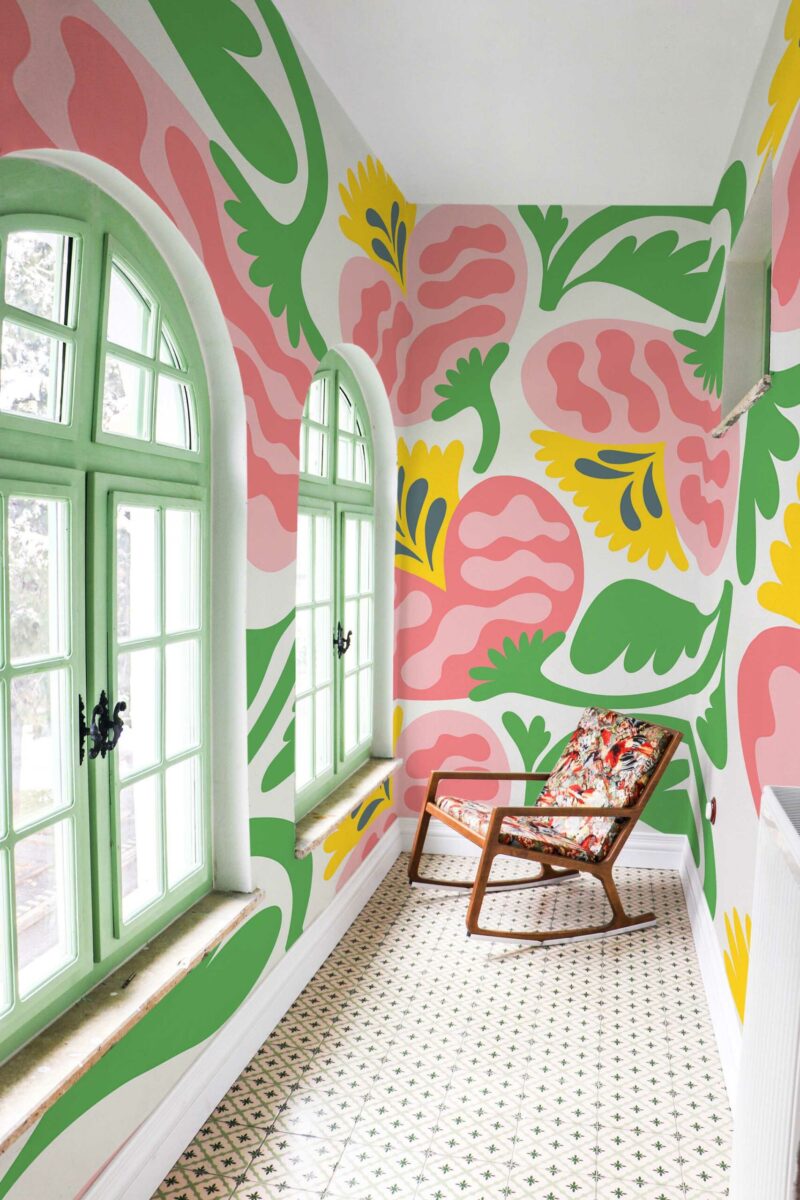 Wildflower Charm wall mural with pink and green retro floral design on a yellow background, perfect for living rooms or creative accent walls.