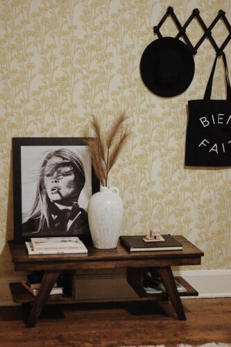 Rustic farmhouse style entryway decorated with Yellow flower peel and stick wallpaper