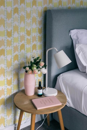 Rustic style bedroom decorated with Yellow ikat peel and stick wallpaper
