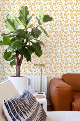 Mid-century style living room decorated with Yellow paisley peel and stick wallpaper