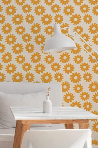 Retro Floral Wallpaper with bold orange daisy motifs on a white background, styled in a minimalist dining nook with a white table, wood legs, and a simple white lamp. The vintage-inspired floral pattern adds warm, cheerful energy to the space.