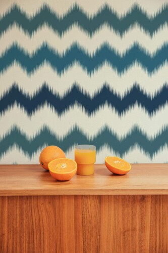 Mid-century style living room decorated with Zig zag ikat peel and stick wallpaper