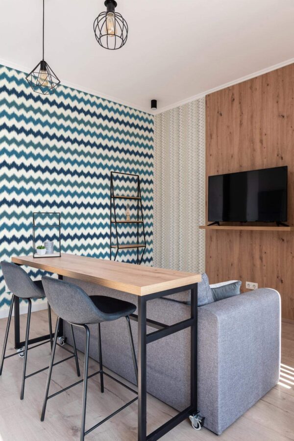 Scandinavian style open living room decorated with Zig zag ikat peel and stick wallpaper