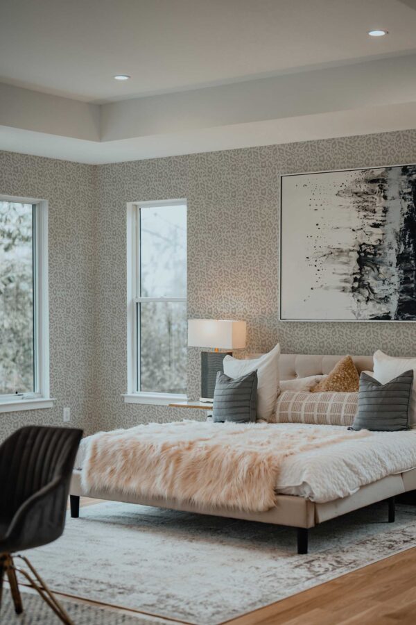 Traditional wallpaper with greige tones and subtle leopard print by Fancy Walls