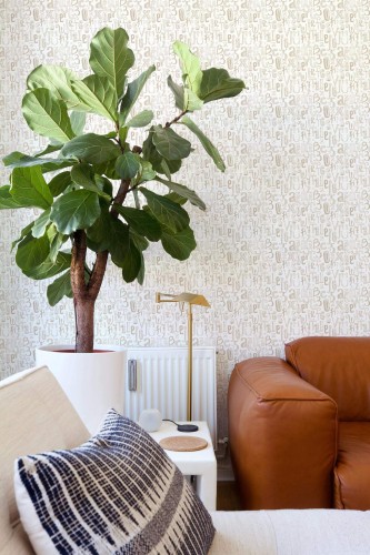 Mid-century style living room decorated with Alphabet peel and stick wallpaper