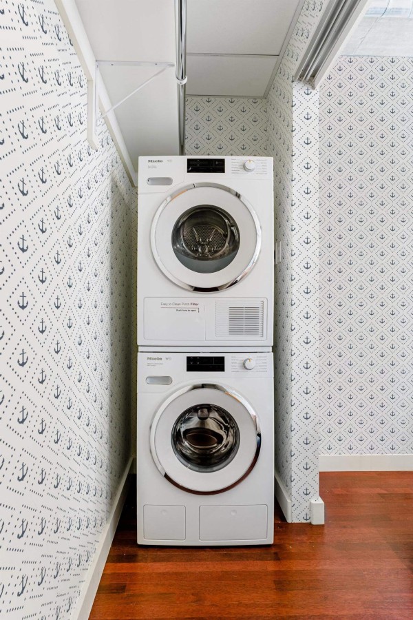 Minimalist style laundry room decorated with Anchor peel and stick wallpaper