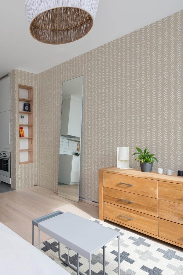 Scandinavian style small apartment decorated with Arrows peel and stick wallpaper