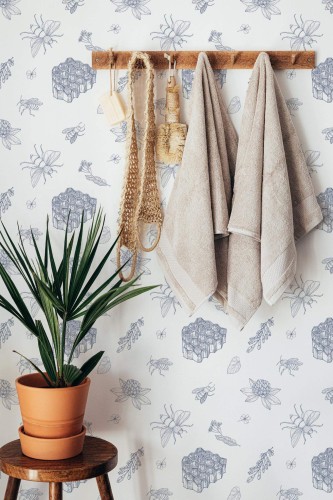Boho style bathroom decorated with Bee and honey peel and stick wallpaper