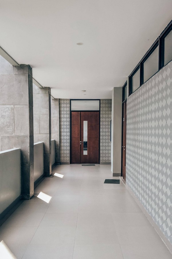 Industrial style hallway with a balcony decorated with Beige and white geometric peel and stick wallpaper