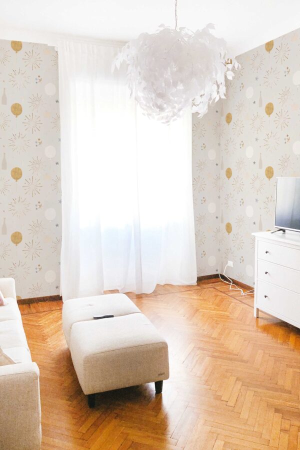 Fancy Walls traditional wallpaper showing stars and balloons in beige tones