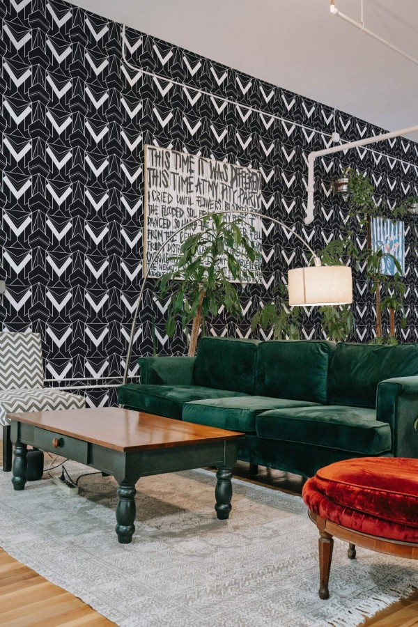 Bold eclectic style living room decorated with Black and white Art deco peel and stick wallpaper and emerald green sofa