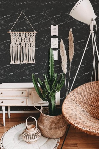 Bohemian style living room decorated with Black Marble peel and stick wallpaper