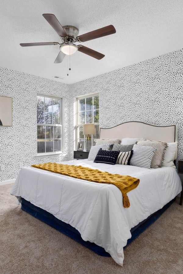Eastern European style bedroom decorated with Black peel and stick wallpaper
