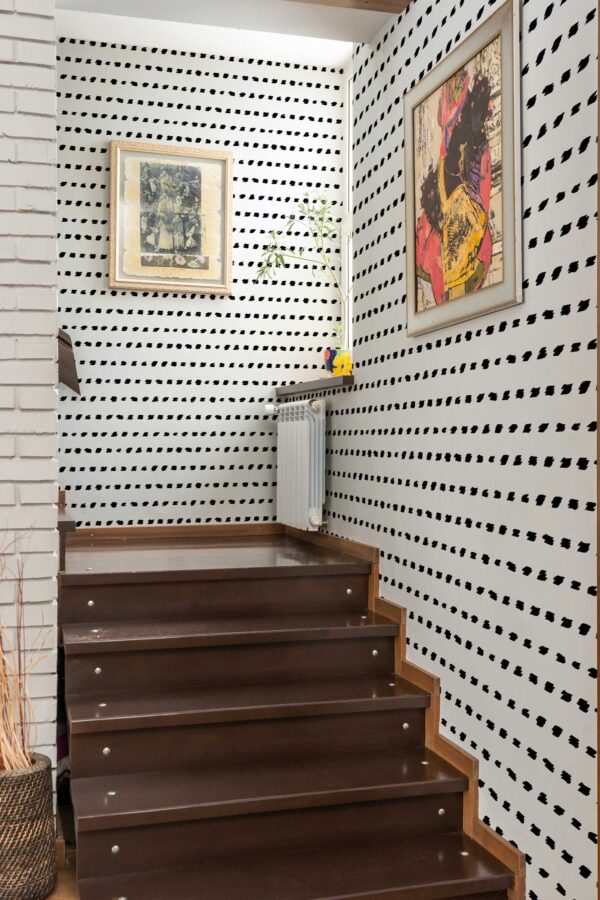 Fancy Walls removable wallpaper in dynamic black and white brush design
