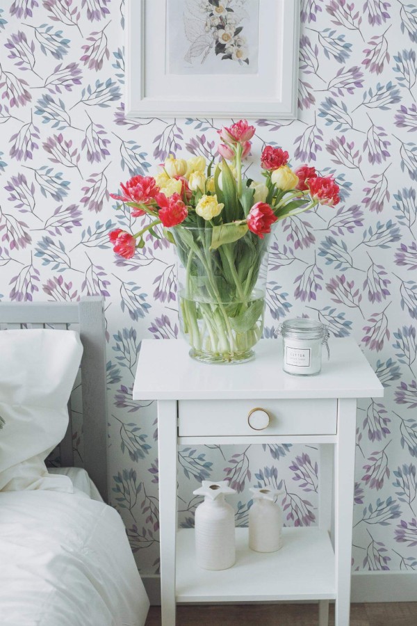 Farmhouse style bedroom decorated with Blue and purple leaf peel and stick wallpaper