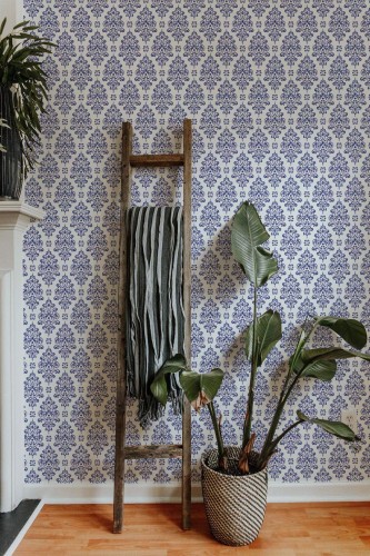 Scandinavian style living room decorated with Blue and white damask peel and stick wallpaper