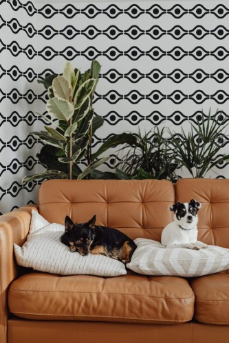 Mid-century modern style living room decorated with Boho abstract eye peel and stick wallpaper