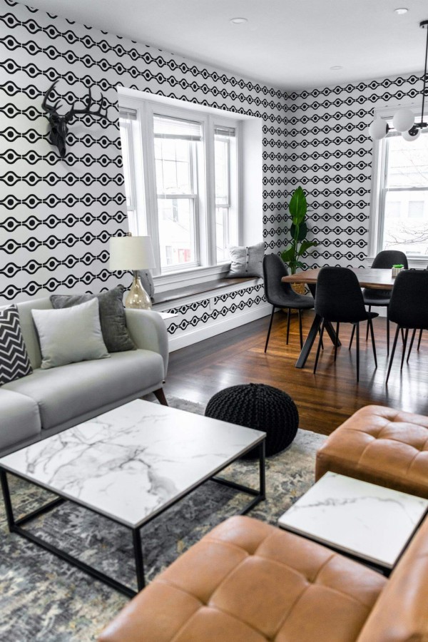 Mid-century modern scandinavian style living dining room decorated with Boho abstract eye peel and stick wallpaper