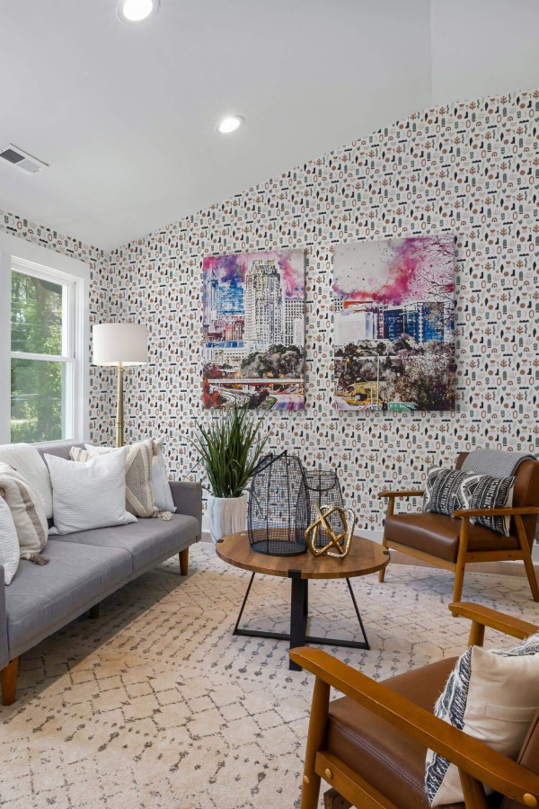 Mid-century modern style living room decorated with Boho shapes peel and stick wallpaper and colorful funky artwork