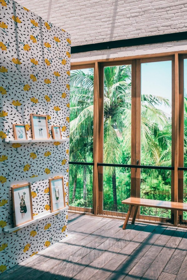 Coastal style living room decorated with Bold floral peel and stick wallpaper